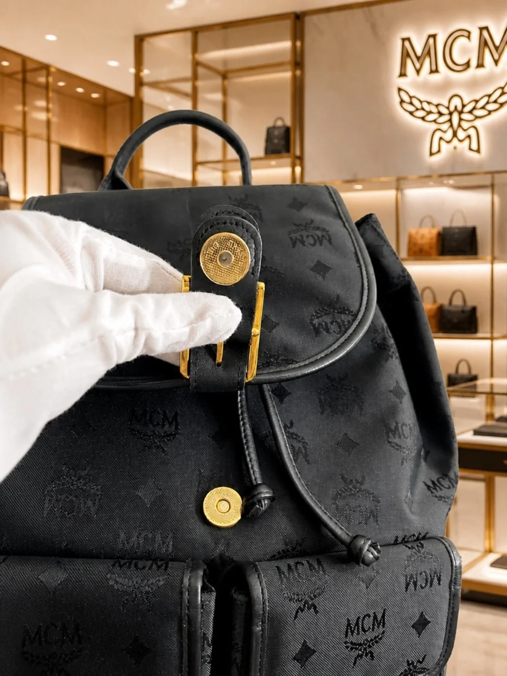 MCM Black Monogram Backpack with Gold-Plated Detail